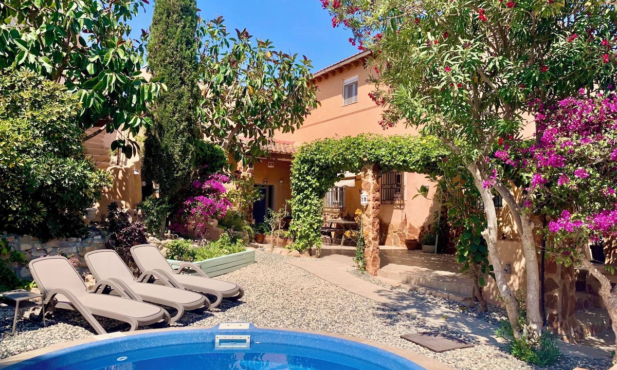 Los Vives House | Loma Alta; a unique 19th century cave house with lush garden and private pool