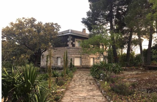 Valdemanco House | Charming rustic cabin with a fabulous garden