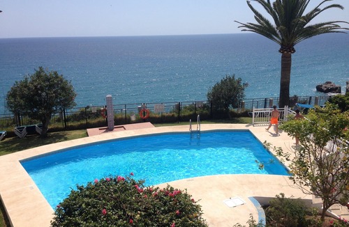 Nerja City Centre Apartment | First line, sea view from terrace, pool, garden, city central & 15m to beach!