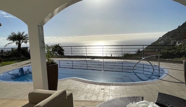 Luxury villa with private heated pool, garden and views of the sea and mountains in Arco da Calheta
